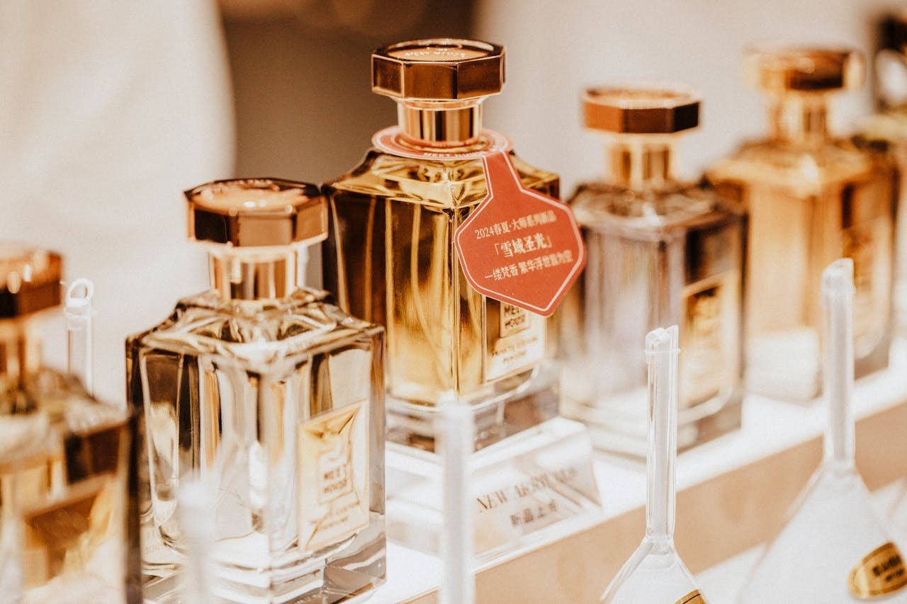 Elegant collection of perfume bottles showcasing luxury fragrances in a stylish retail display.